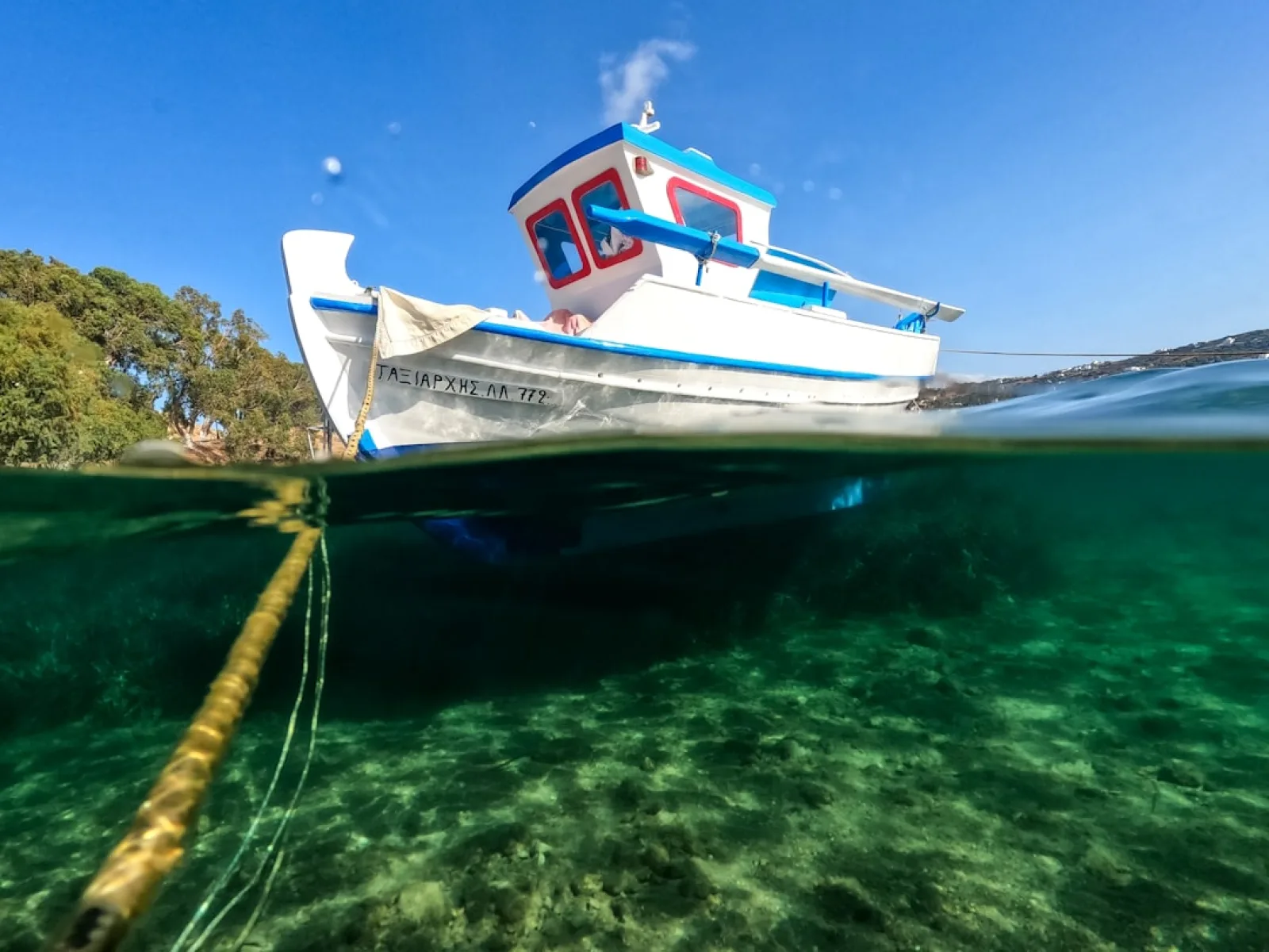 a boat in the water with a rope in the foreground