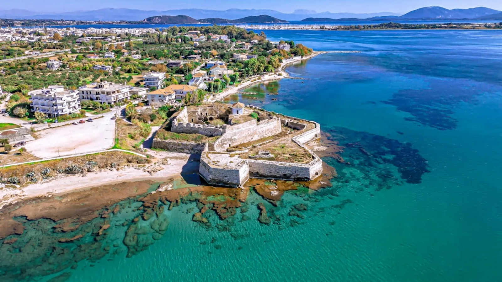 Ancient coastal fortress on a clear blue sea