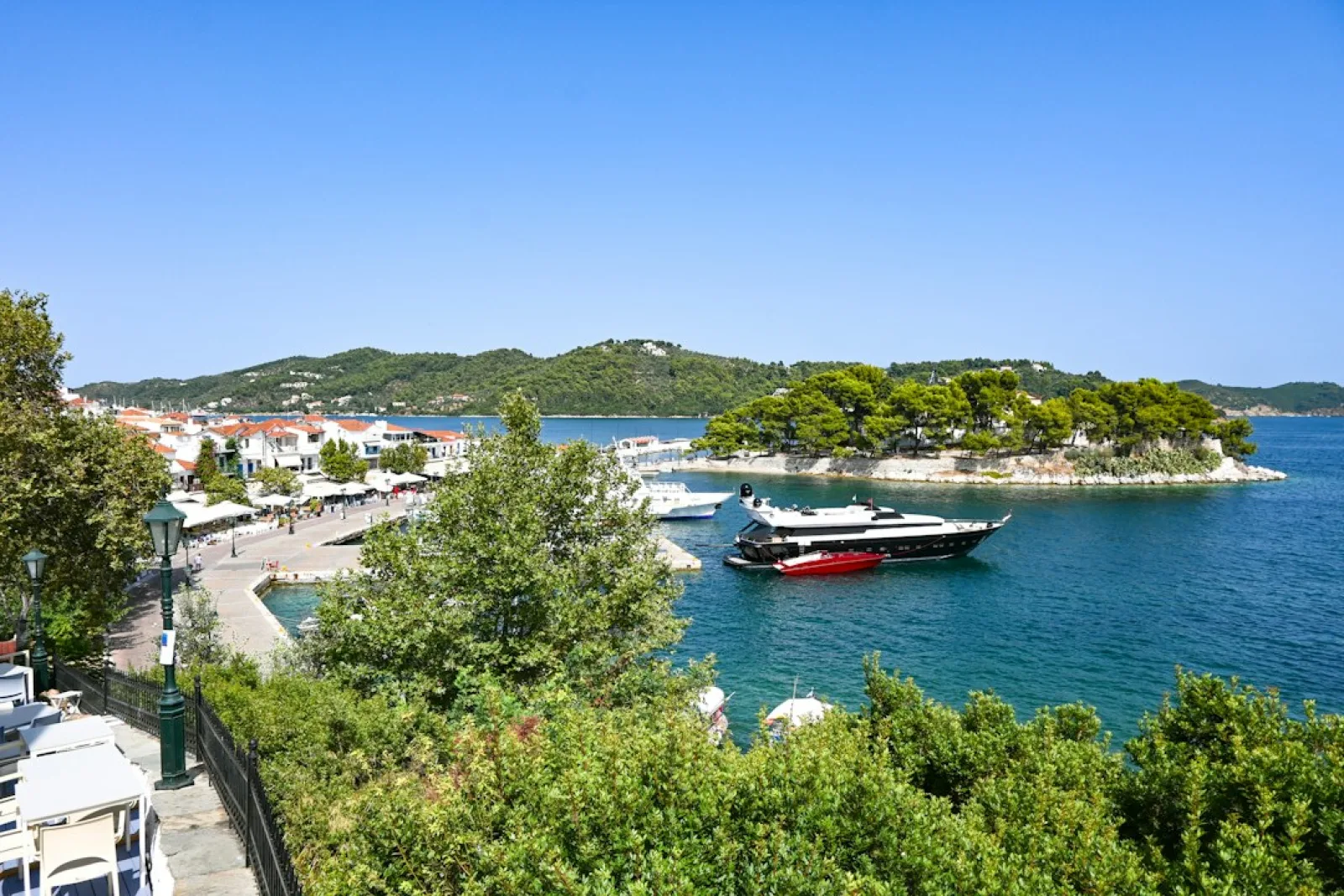 Skiathos red and white boat on sea during daytime