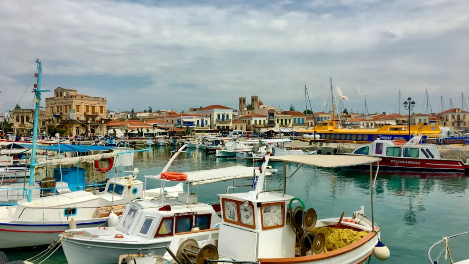 white and brown boat on dock during daytime